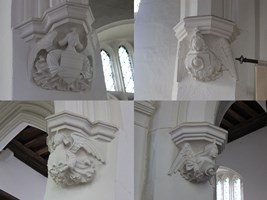Cople - All Saints. Roof corbels.