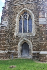 Houghton Conquest - All Saints. Tower, west door and window. Houghton Conquest - All Saints. Tower, west door and window.