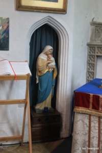 Henlow - St Mary. South aisle, statue and rood stair opening.