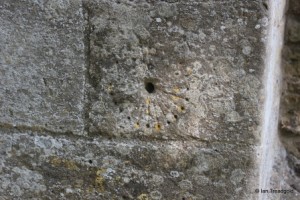 All Saints, Kempston. South porch, Mass dial.