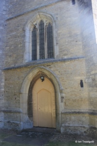 Pertenhall - St Peter. West door and window.