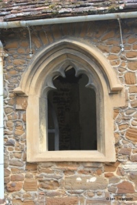 Blunham, St Edmund or St James. South porch west window.