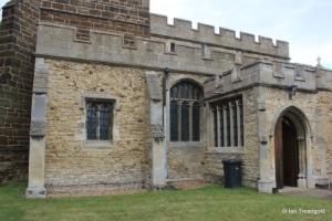 Cople - All Saints. South aisle and porch from the south-west.
