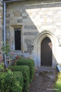 Chalgrave - All Saints. Chancel, south side, priest's door and south-west window.