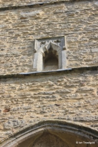 Renhold - All Saints. Statue niche, tower.
