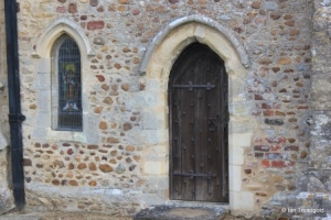 Bolnhurst - St Dunstan. Chancel south-west window and priest's door.