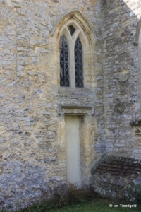 Carlton - St Mary the Virgin. Chancel, north-west window and door.