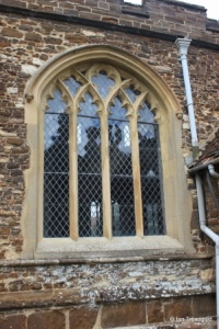 Blunham, St Edmund or St James. South aisle, south-west window.