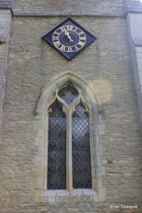 Dean, All Hallows. West window and clock.